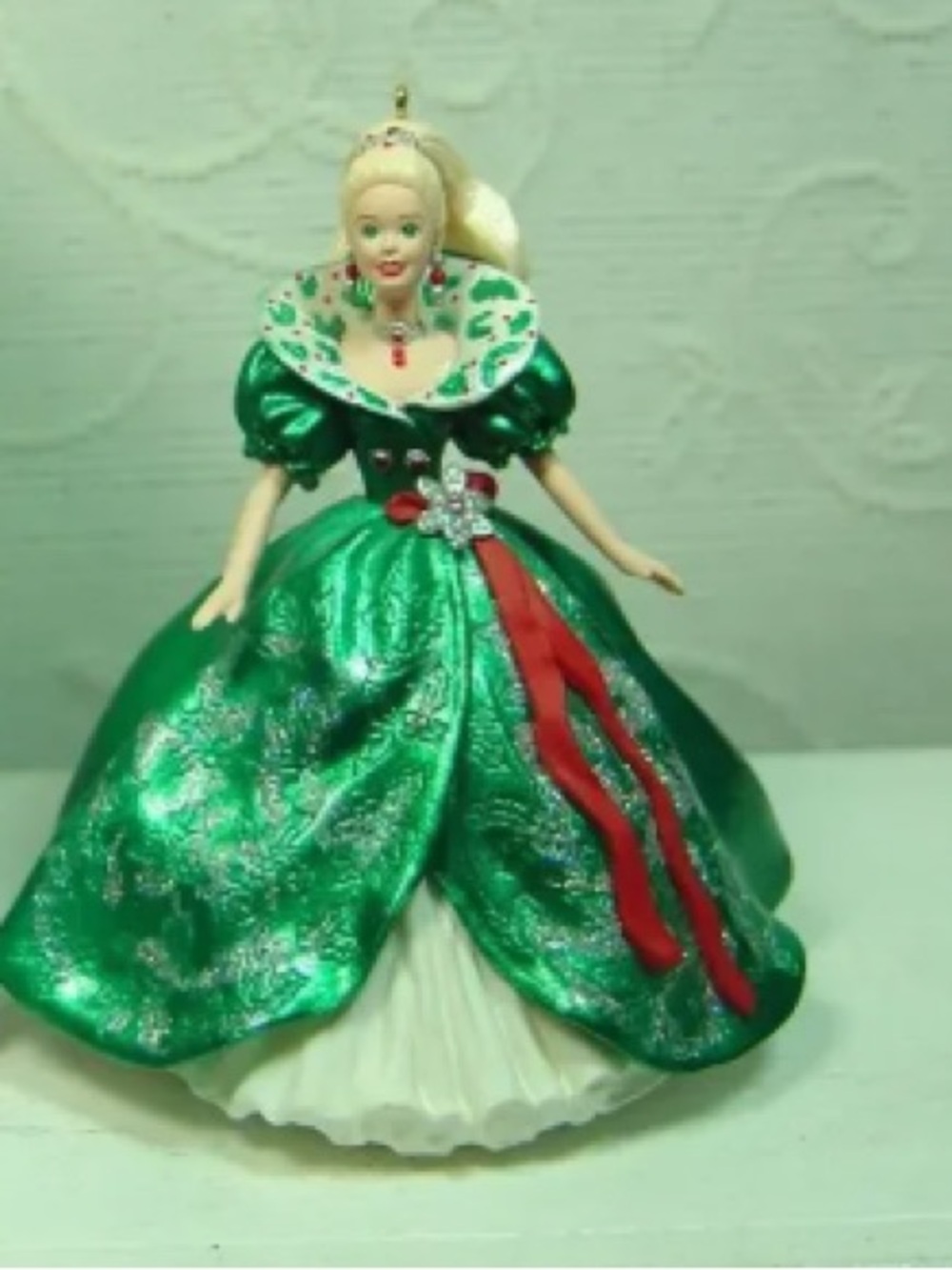Festive Green Holiday Doll Ornament with Red Accents